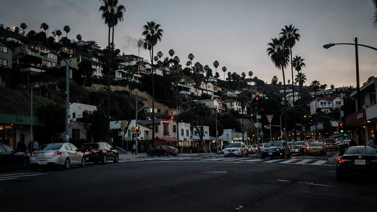 Busy Echo Park neighborhood intersection at dusk with hillside homes