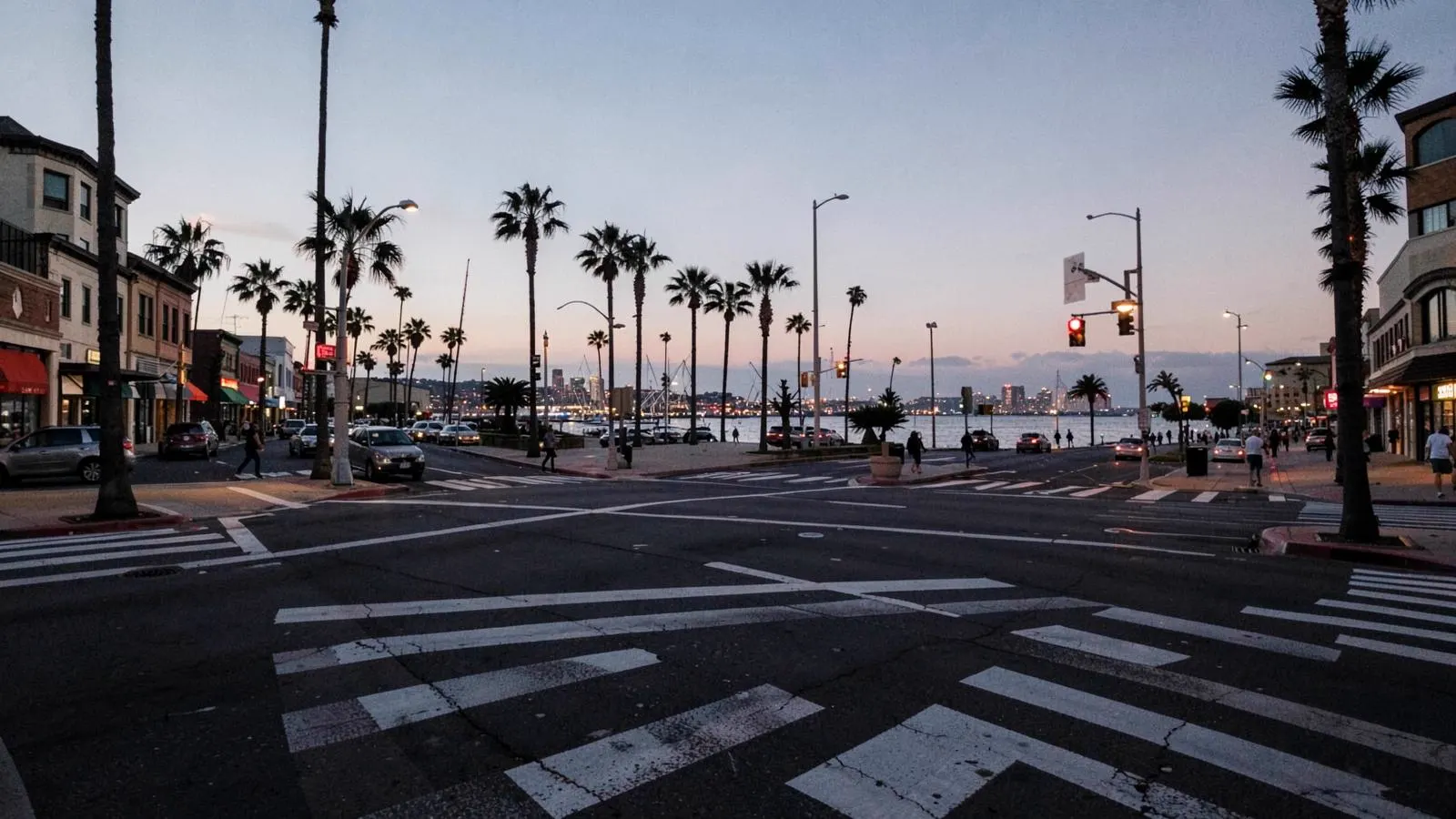 Wide crosswalk on a downtown Long Beach boulevard at dusk near the harbor